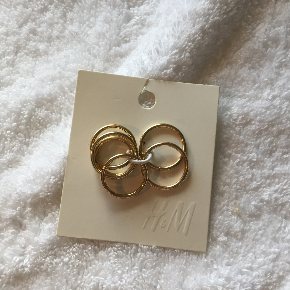 H&M package of goldtone rings with bonus